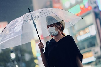 girl in mask in umbrella